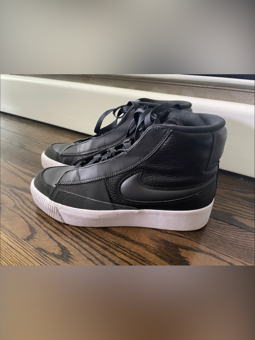 Nike Black High-Top Sneakers with White Sole and Black Swoosh
